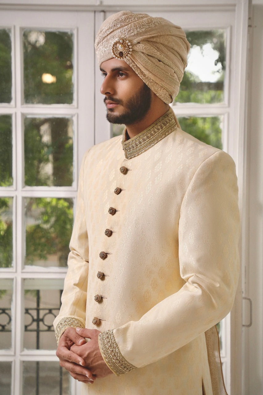 Hazel gold sherwani with matching inner and turban.
