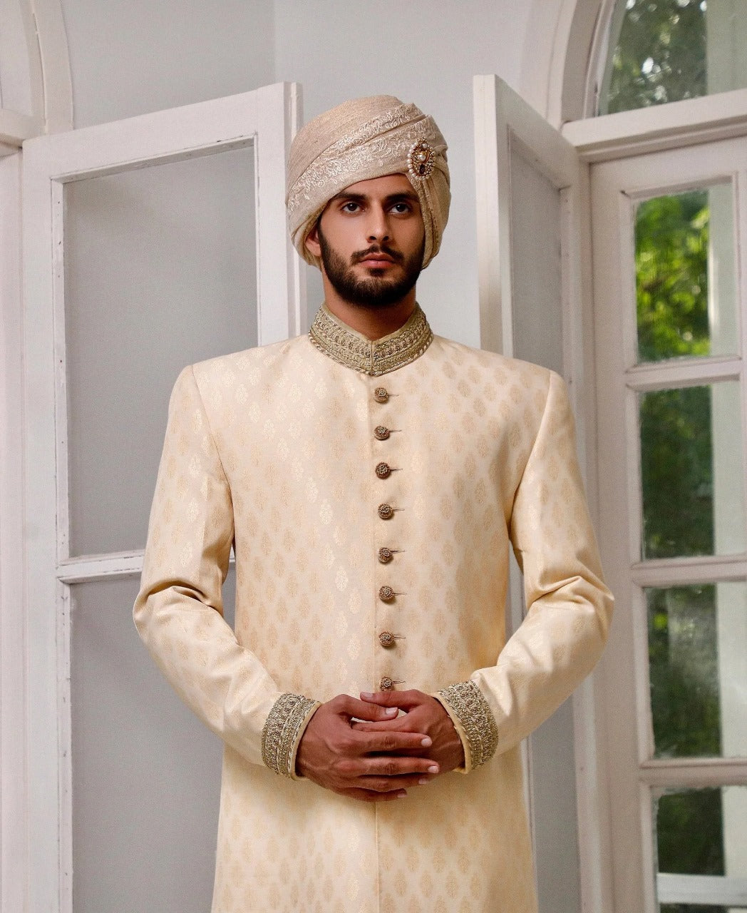 Hazel gold sherwani with matching inner and turban.